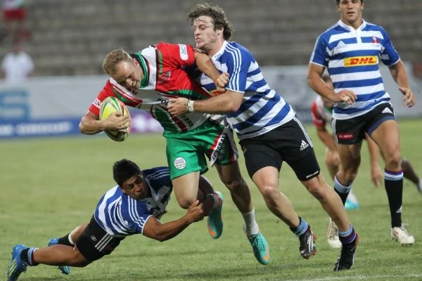 rugby players tackling